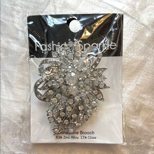 New in packaging large Silver Rhinestone Brooch